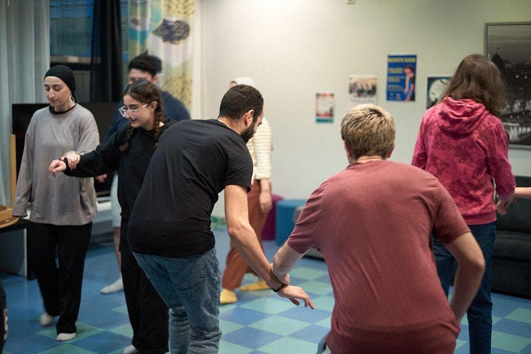 Theater workshop participants engaged in an activity